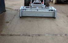 Yardscraper attached to tractor