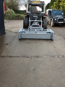 Yardscraper attached to tractor